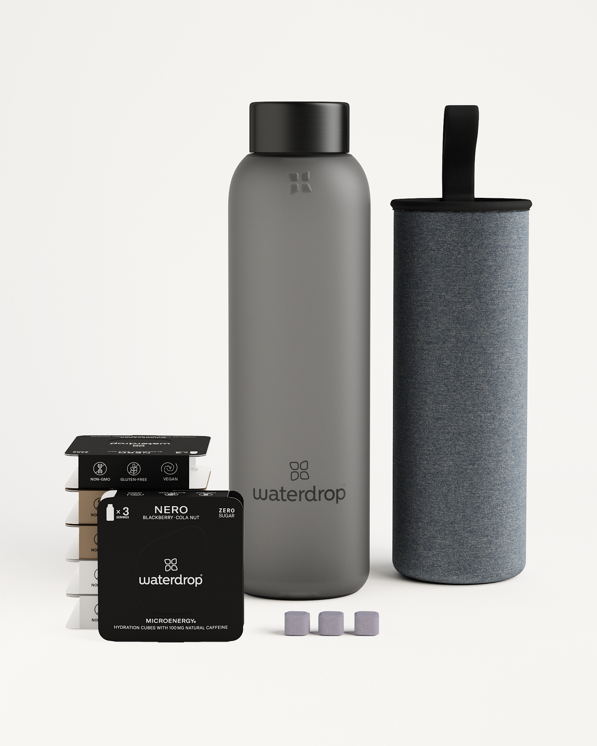 Starter Set Microenergy Glass featuring a water bottle, water filter, and packaged flavor cubes for a caffeine boost, 80-100mg per serving.