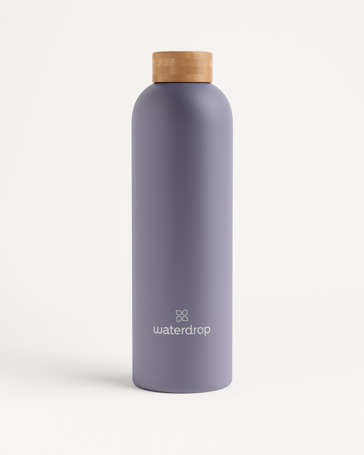 Thermo Steel bottle with wooden cap, double-walled stainless steel, maintains drink temperature. Available in 400ml, 600ml, or 1L.