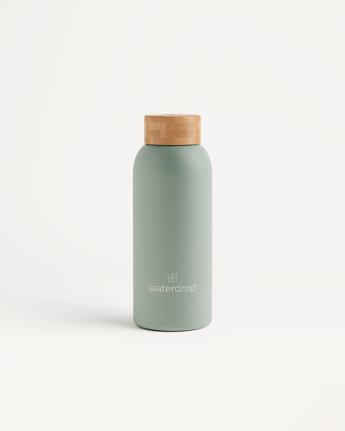 Thermo Steel bottle with a wooden cork top, featuring double-walled stainless steel for maintaining drink temperature, available in 400ml, 600ml, or 1L.