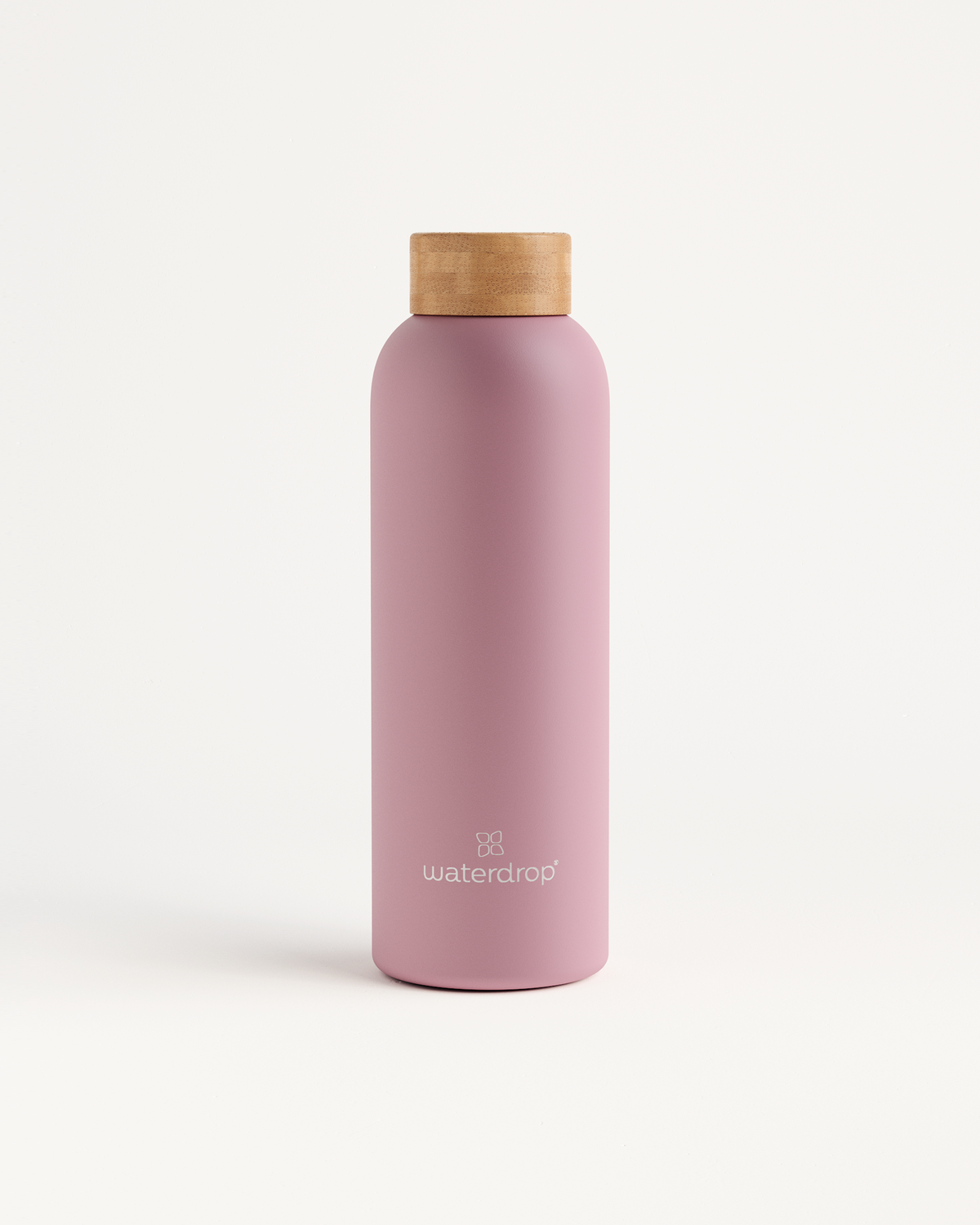 Pink Thermo Steel bottle with a wooden cork top, designed to keep drinks cold for 24 hours or hot for 12 hours.