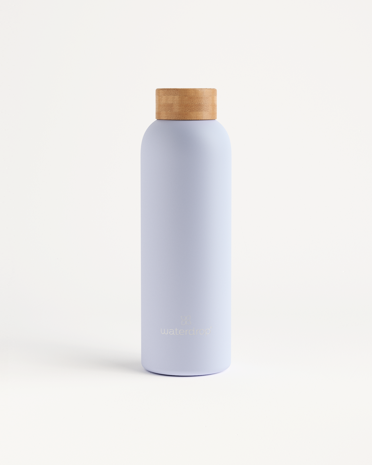 White Thermo Steel bottle with brown cap, designed to keep drinks cold for 24 hours or hot for 12 hours, available in multiple sizes.