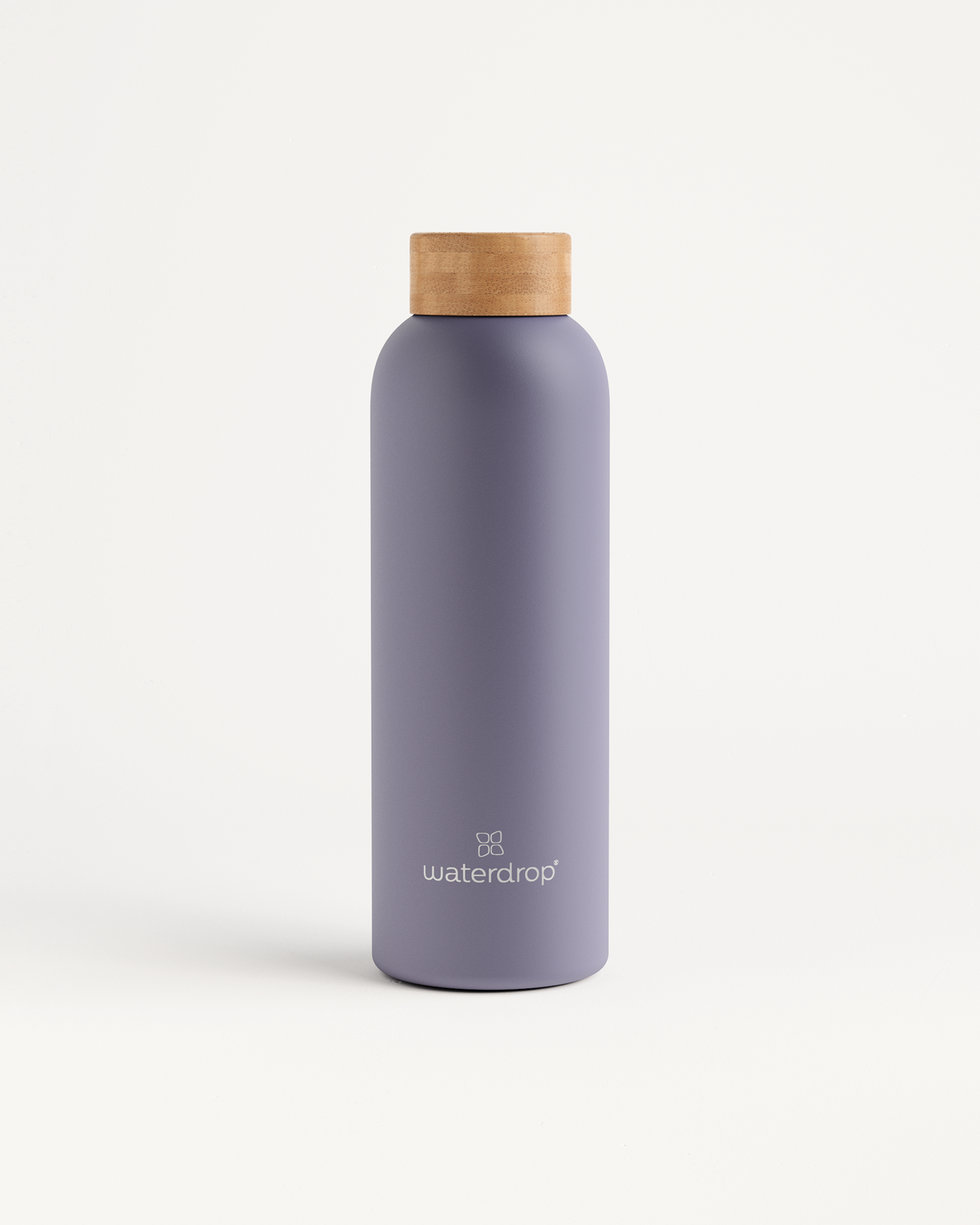 Thermo Steel bottle with a wooden cap, designed to keep drinks cold for 24 hours or hot for 12 hours, available in 400ml, 600ml, and 1L.